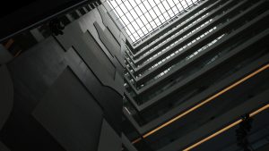 Ground-level view of a building showcasing its architectural design and surrounding environment.