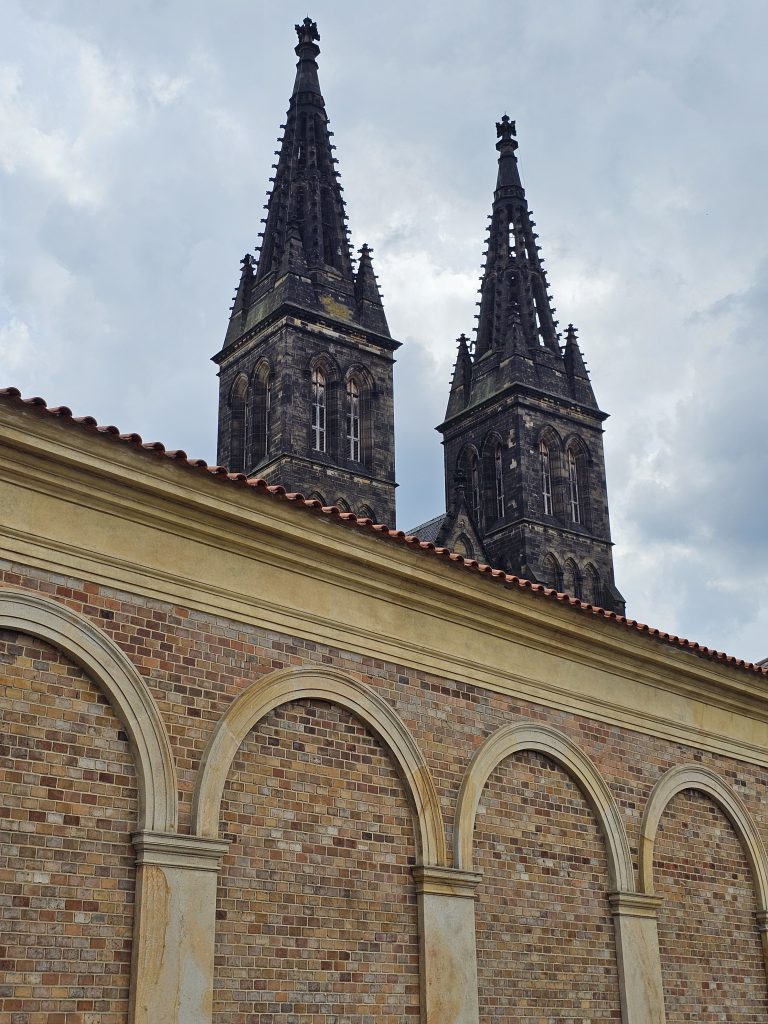 The bell towers and a section of the outer wall of Basilica of St. Peter and St. Paul in Vy?ehrad, Prague, Czech Republic.