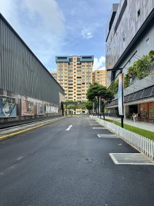 A clean road in front of a big public mall in Singapore. Singapore is known as one of the clean countries. 

