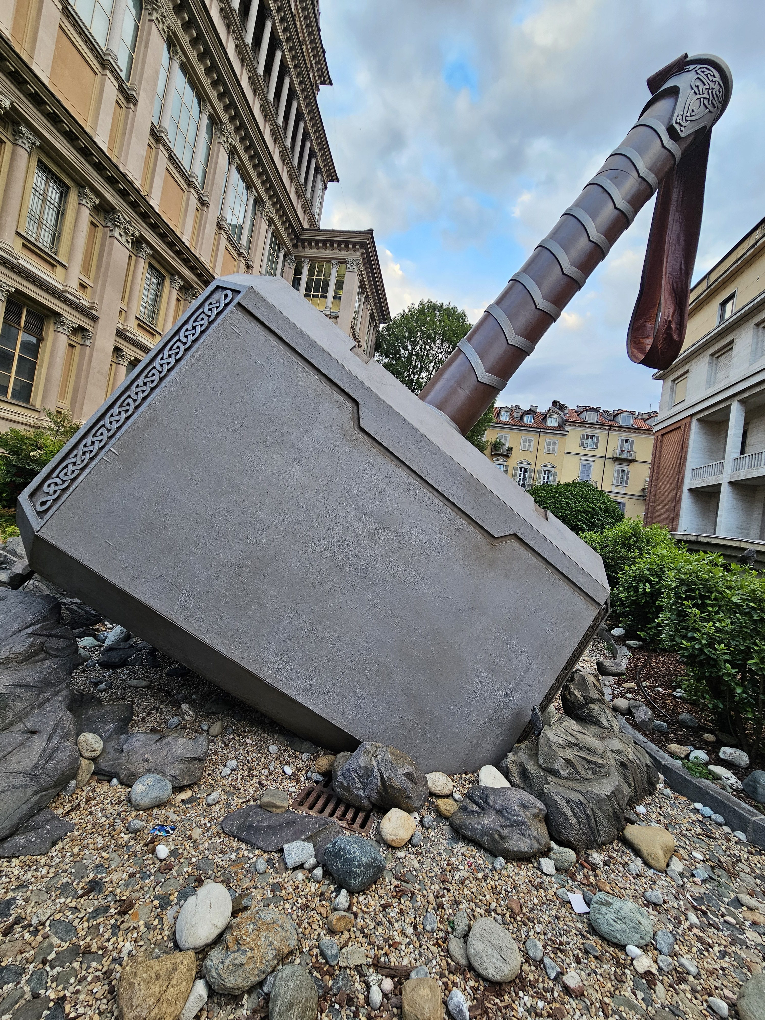 Thor's giant hammer, Mjolnir, rests near the Mole Antonelliana in Turin, Italy, as part of a Marvel memorabilia exhibition.