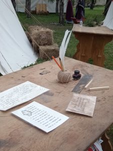 A writing table in a medieval knights’ camp
