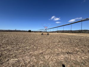 A very large irrigation system in a field.  It’s early spring, so no growth yet.
