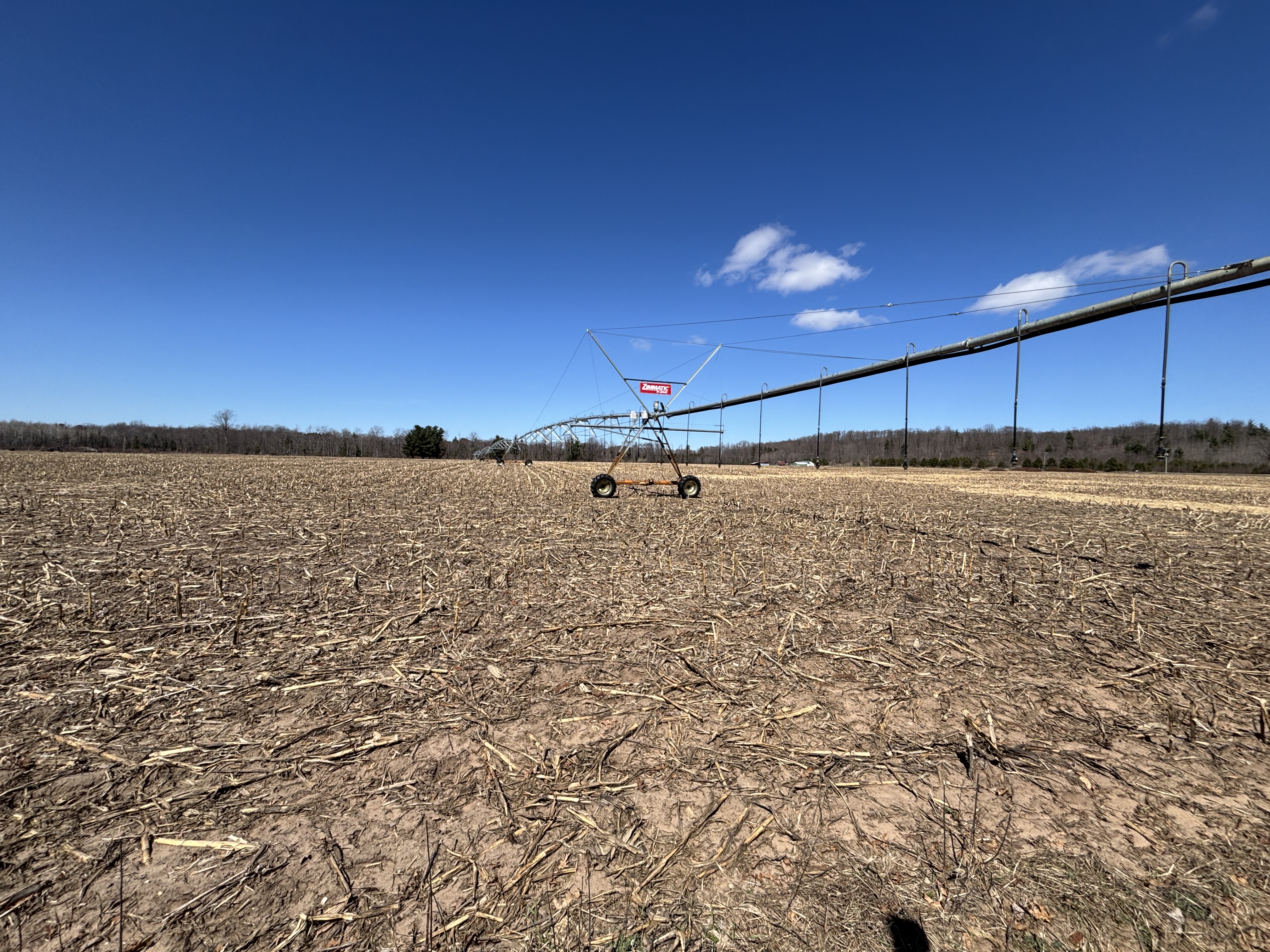 A very large irrigation system in a field. It's early spring, so no growth yet.