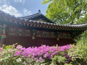 A close-up view of a traditional Asian building with a gracefully curved roof adorned with intricate decorations. 