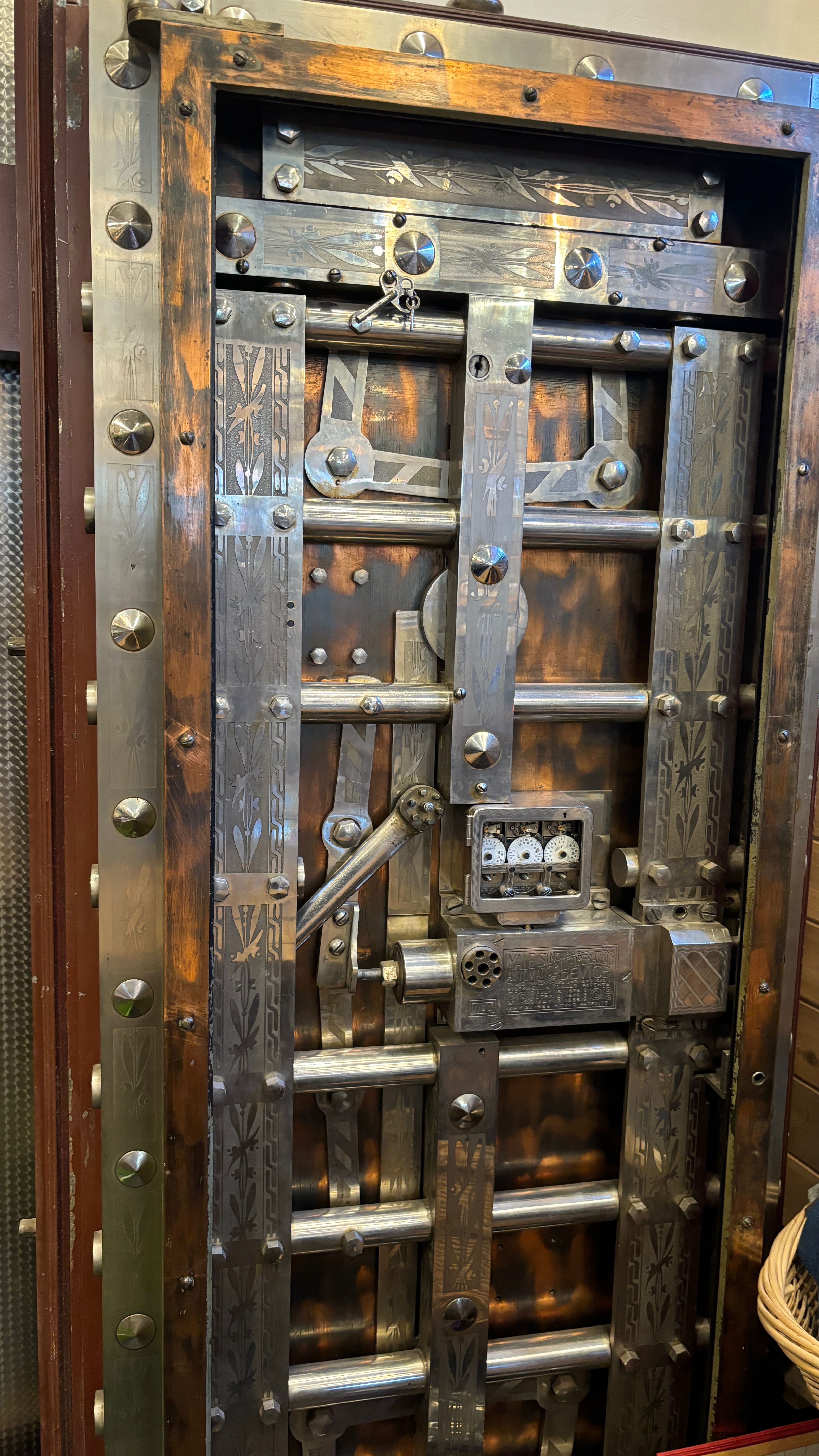 View of the inside of a bank vault door, showing its complicated workings.