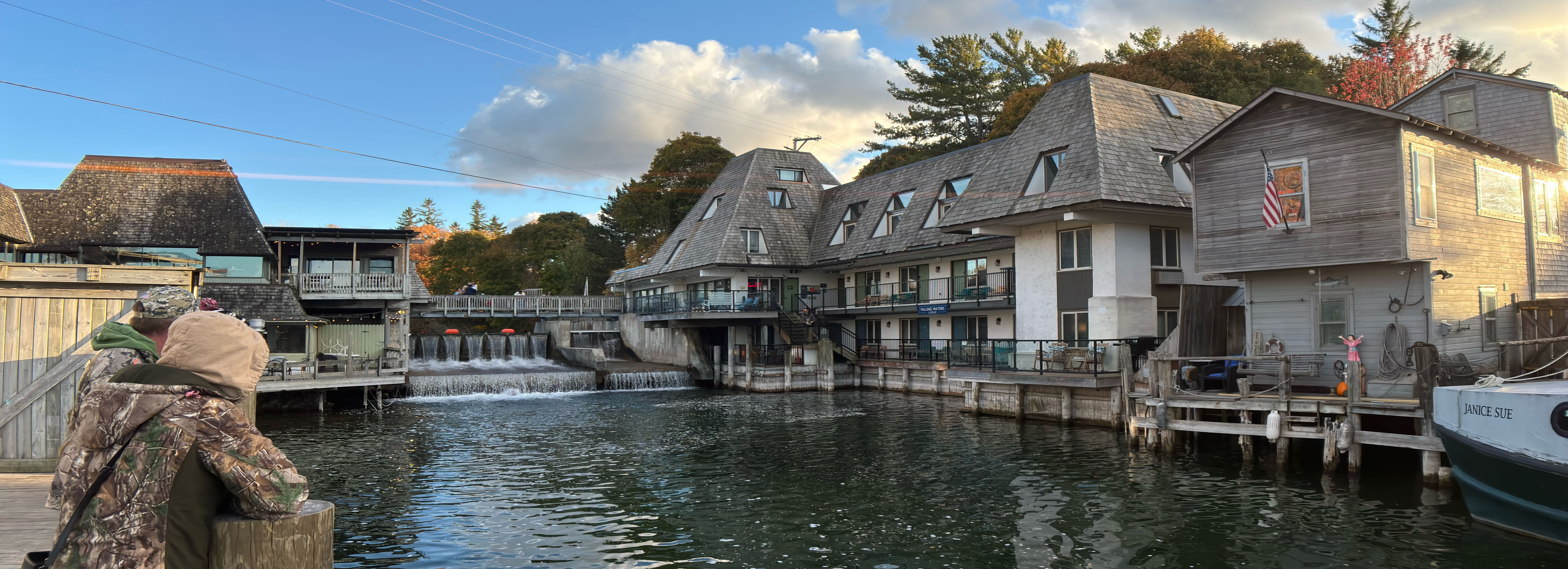 View of restaurants and fishing huts around the waterfall in downtown Leelanau, MI.