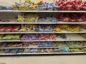 Store shelves filled with a vairety of Easter candy.
