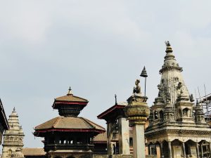 Bhaktapur Durbar Square — ancient temples with carved stone, pagoda roofs, and King Bhupatindra Malla’s statue.