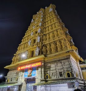 Night view of the sacred and majestic golden gopuram of Sri Chamundeshwari Temple in Mysuru