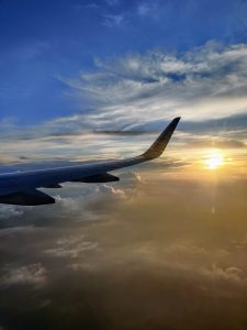 Sunset in the sky captured from an airplane window 
