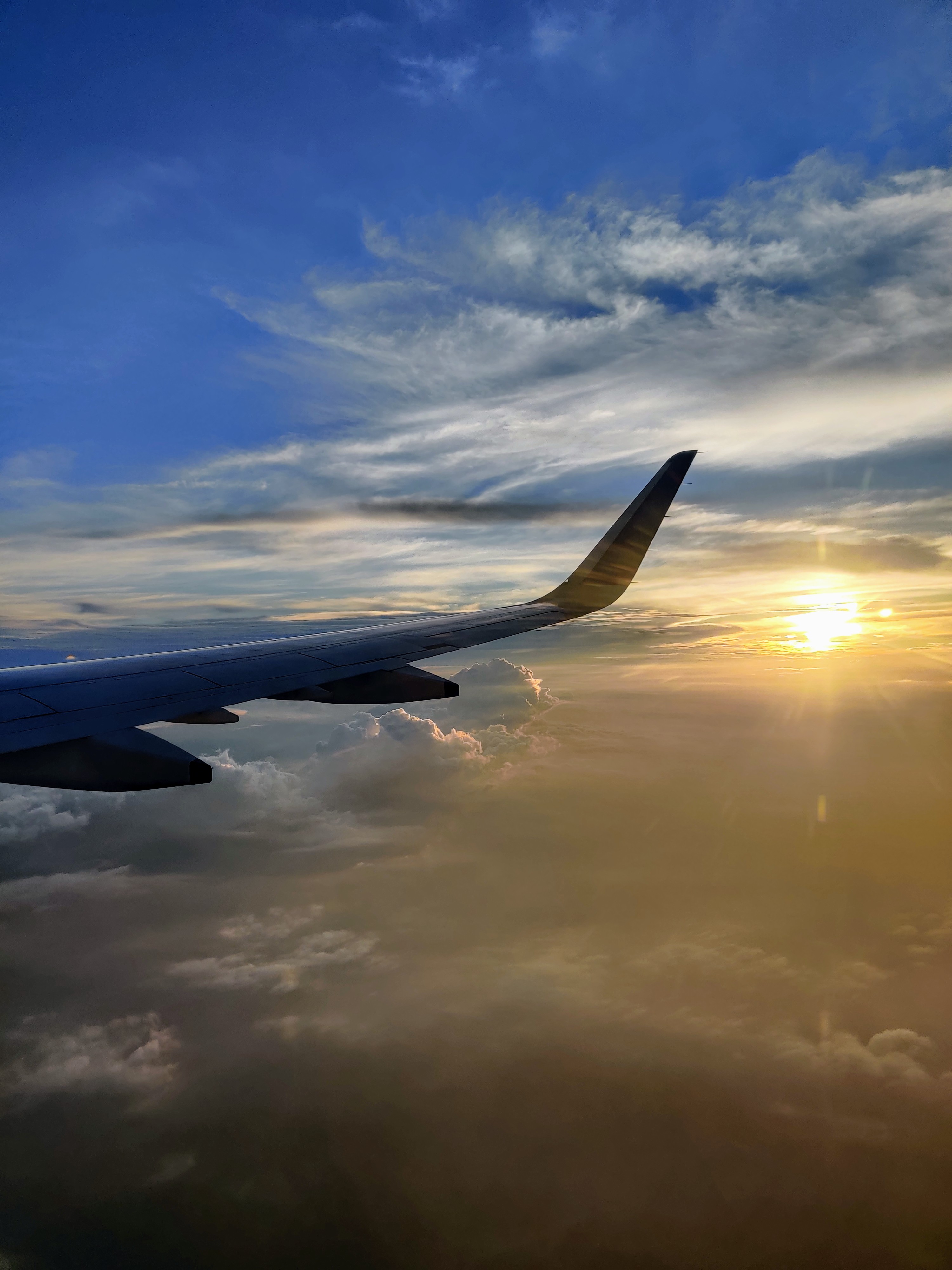 Sunset in the sky captured from an airplane window