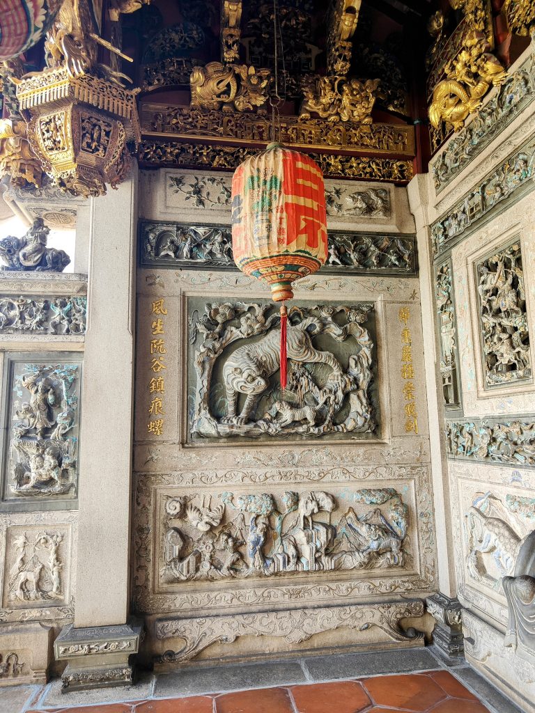 Intricate stone carvings, a traditional Chinese lantern, and ornate gold detailing inside Khoo Kongsi Clan Temple, a historic Chinese clan house in George Town, Penang, Malaysia. A stunning showcase of Hokkien heritage.
Note to moderators: Location provides cultural context. Please retain it.