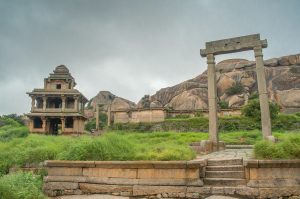 The image shows a section of the Chitradurga Fort, also known as “stone fortress” (Kallina Kote), located in Chitradurga, Karnataka. The fort is built on a landscape of bold rock hills and picturesque valleys with large boulders. 
