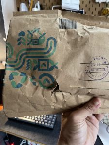 A parcel from Singapore with the background of a home office. 
