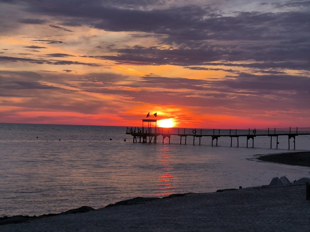 A photo of the sun setting in Durres, Albania