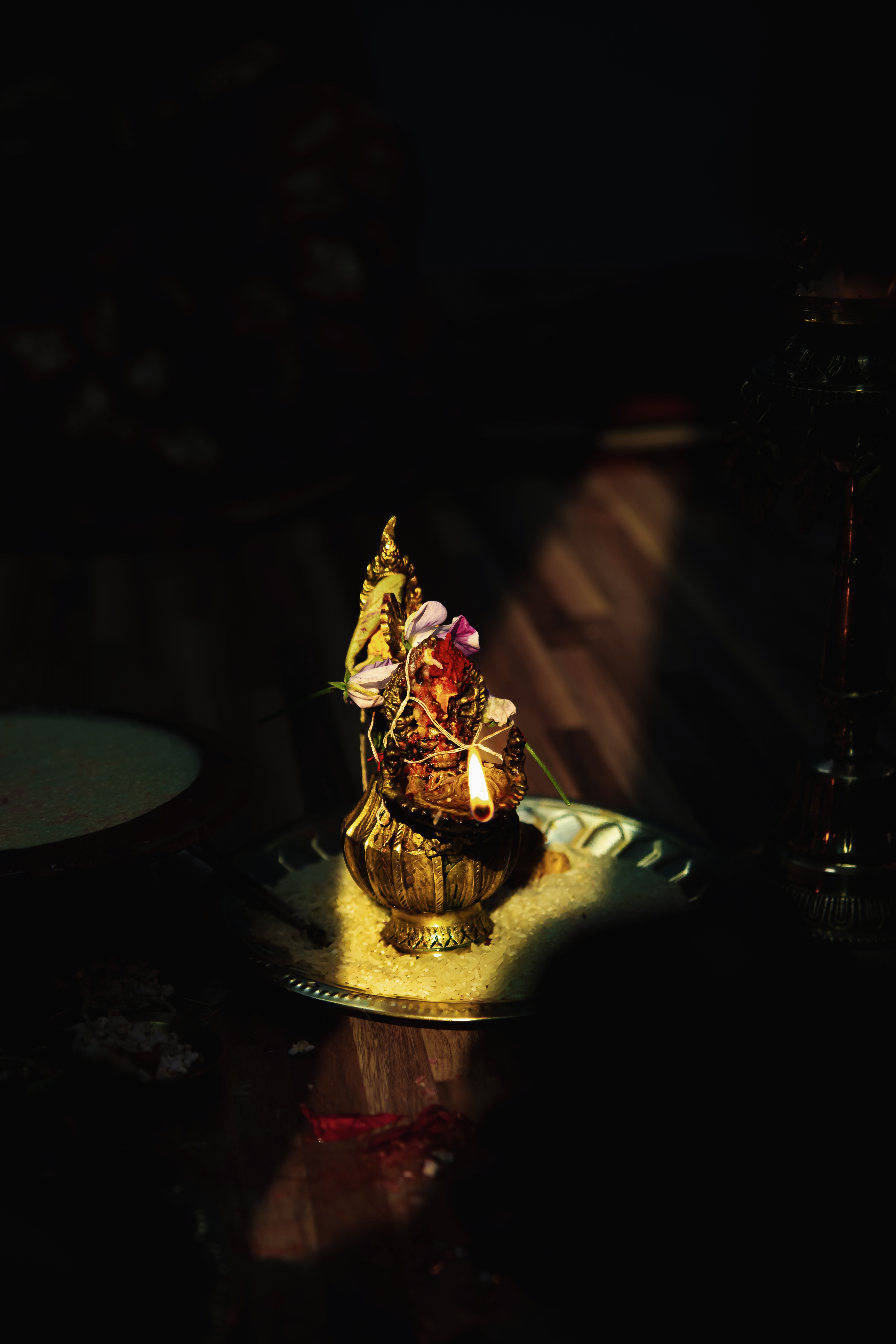A beautifully arranged brass lamp embellished with flowers