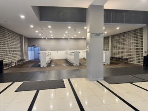 An indoor space featuring a large tiled floor with black and white patterns. 