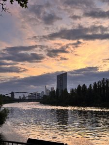 Evening view of Rhine river in Frankfrut Germany and the central bank building in the back. This photo is taken from a resuarant located in the bank of the river. 