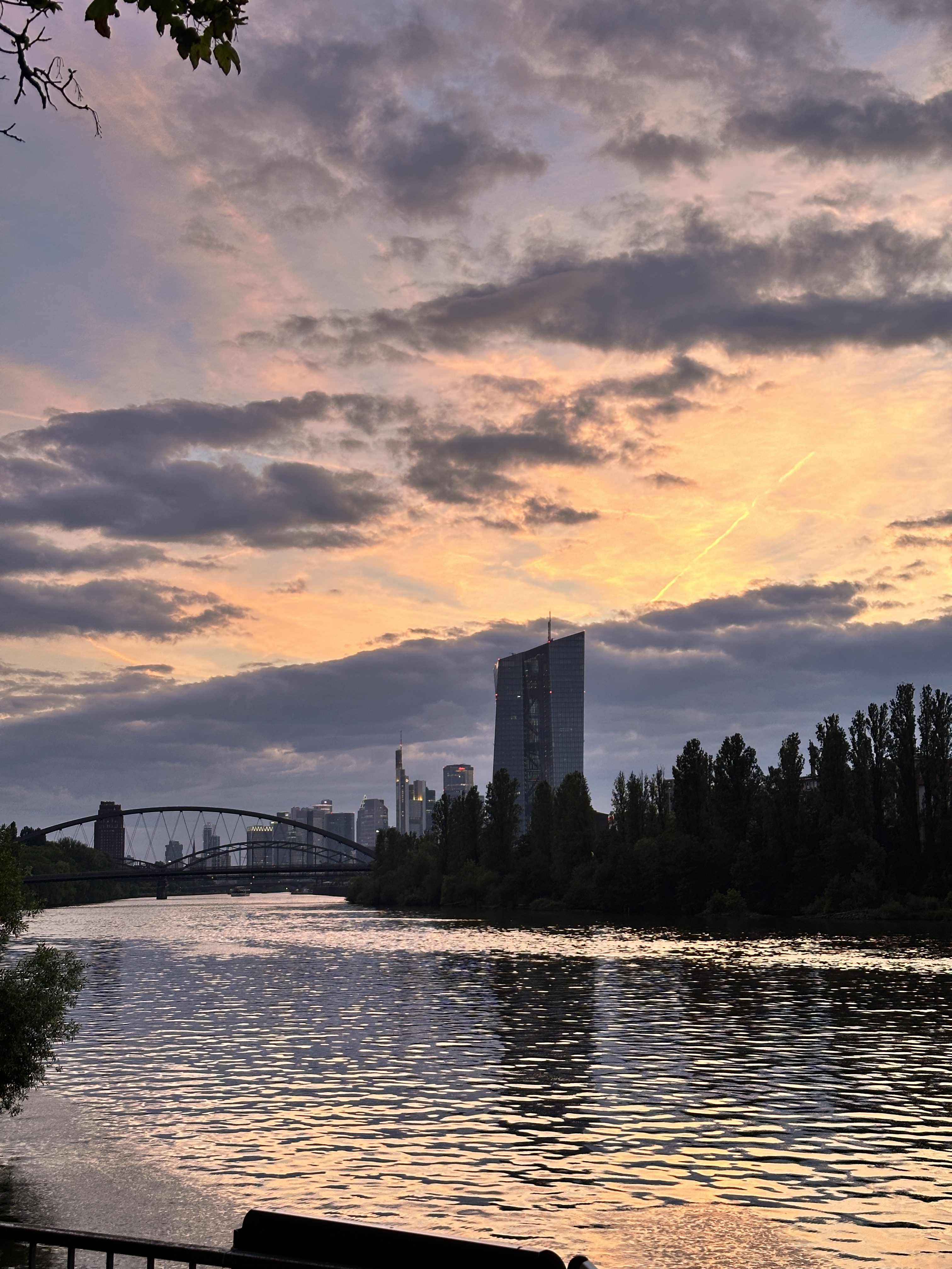 Evening view of Rhine river in Frankfrut Germany and the central bank building in the back. This photo is taken from a resuarant located in the bank of the river.