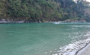 

A serene Budigabdaki river scene with turquoise water flowing gently.