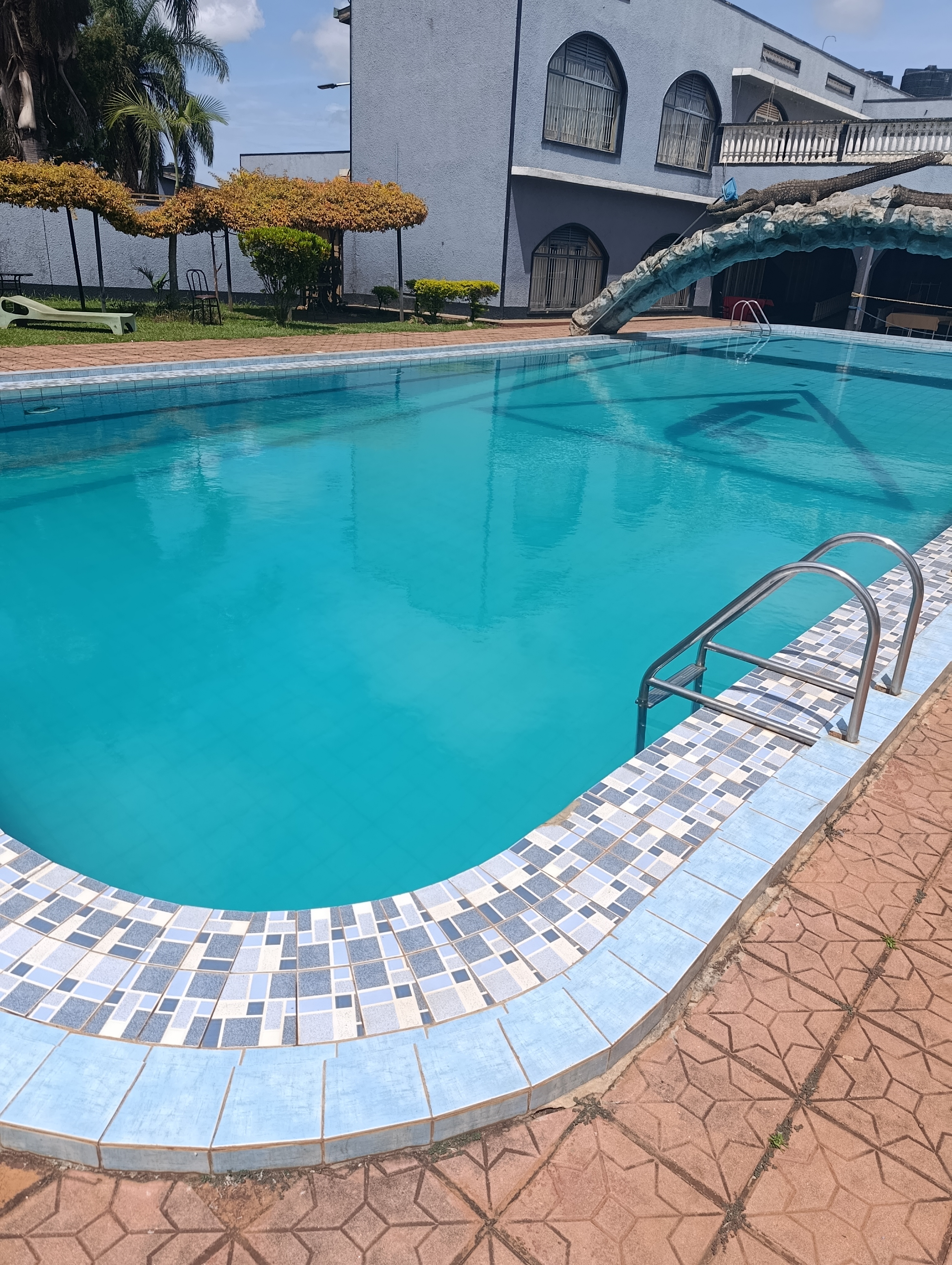 A Photo swimming pool on a sunny afternoon.
