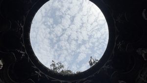 A view of the sky framed by the intricately carved stone dome of Shree Kopeshwar Mandir.