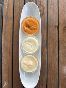 Three different types of sauce are served at a table in a Restaurant in Germany. 