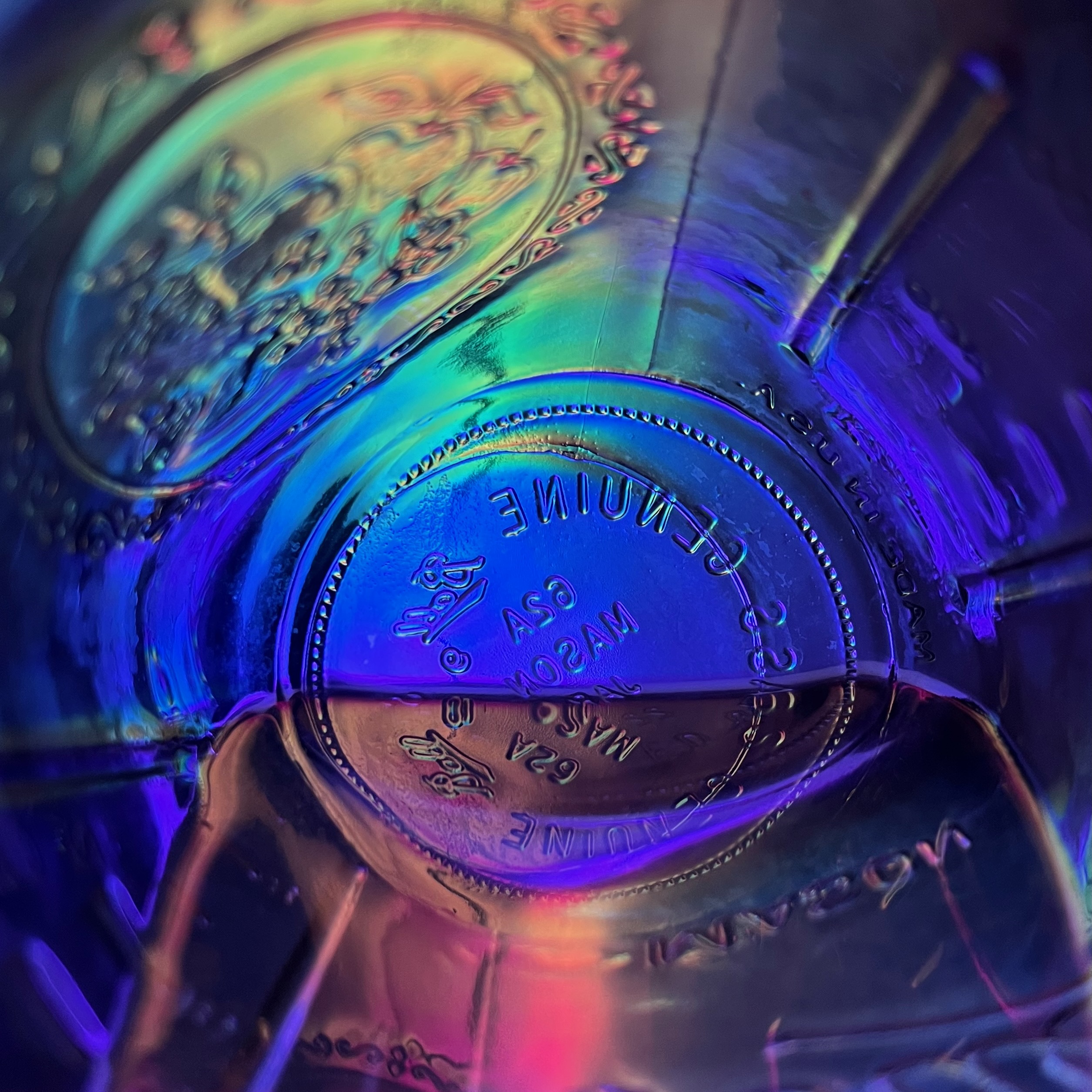 Abstract Rainbow lights behind water and glass.