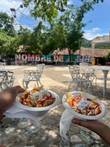 
French fries topped with mayonnaise, ketchup, and shredded cheese—commonly called papas chucas.