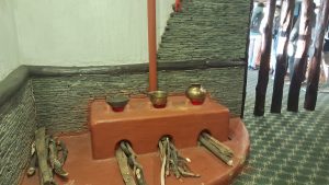 Nepali Chulo, a traditional clay or mud stove commonly used in rural Nepal for cooking. I tfeatures three fire holes and is fuled by wood.