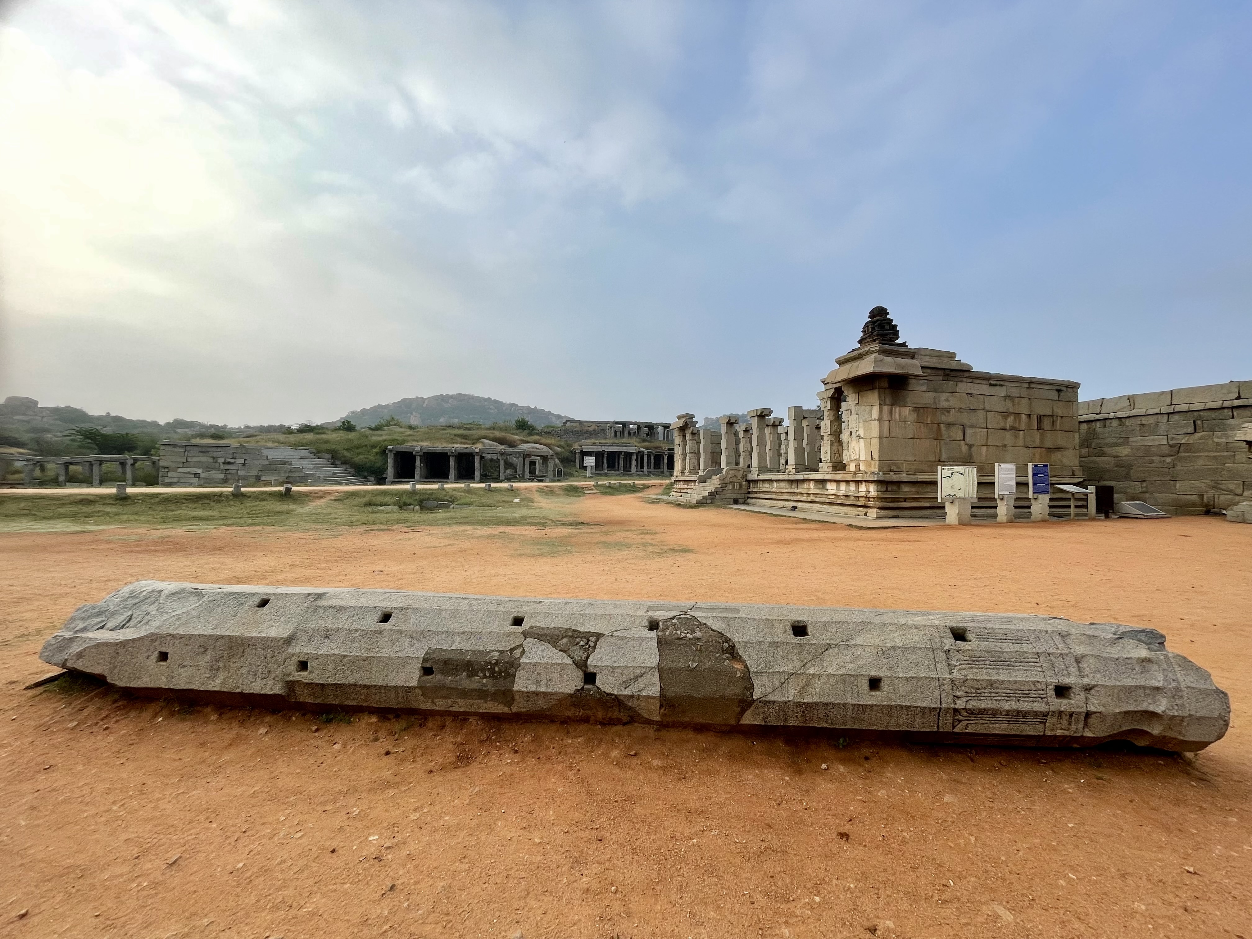 A fallen stone pillar marks the age and history of Hampi’s Vijaya Vittala Temple.