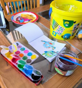 Painting monsters with watercolors with a plate of French fries.