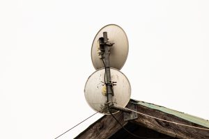 2 Microwave dishes used for internet mounted on a roof