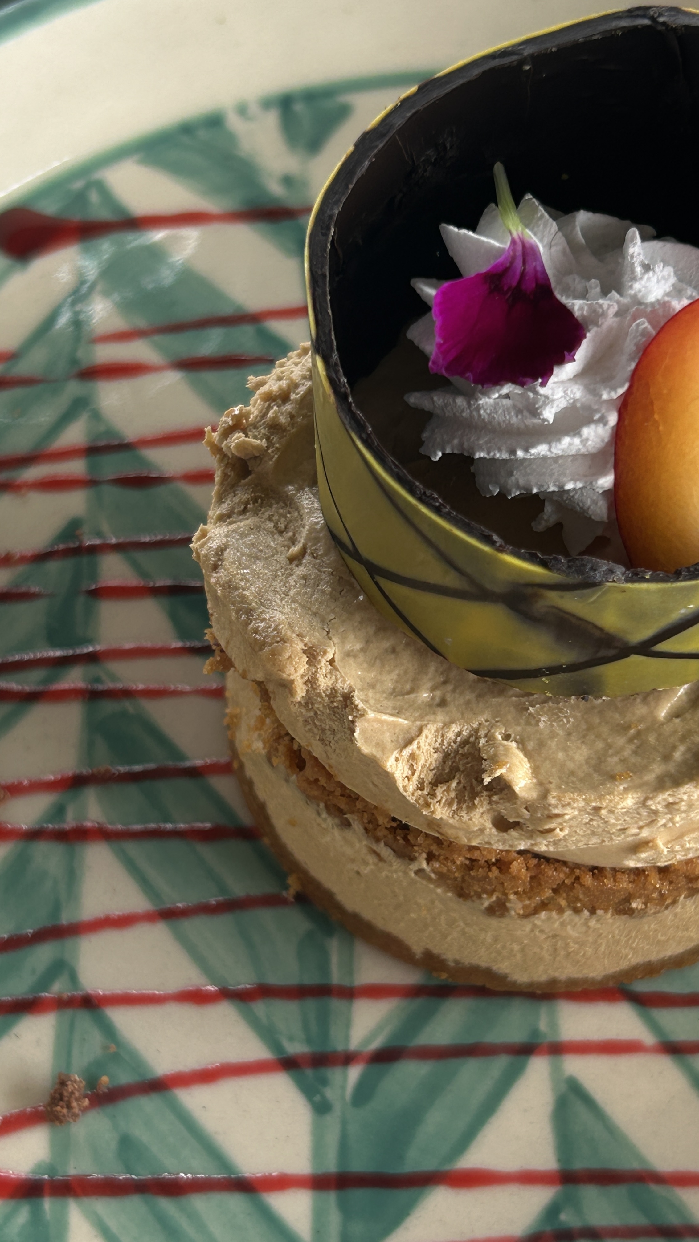 A close view of multiple layered and well decorated lotus biscoff cup cake.