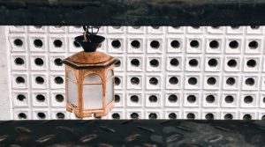 Lamp against white latticework backdrop