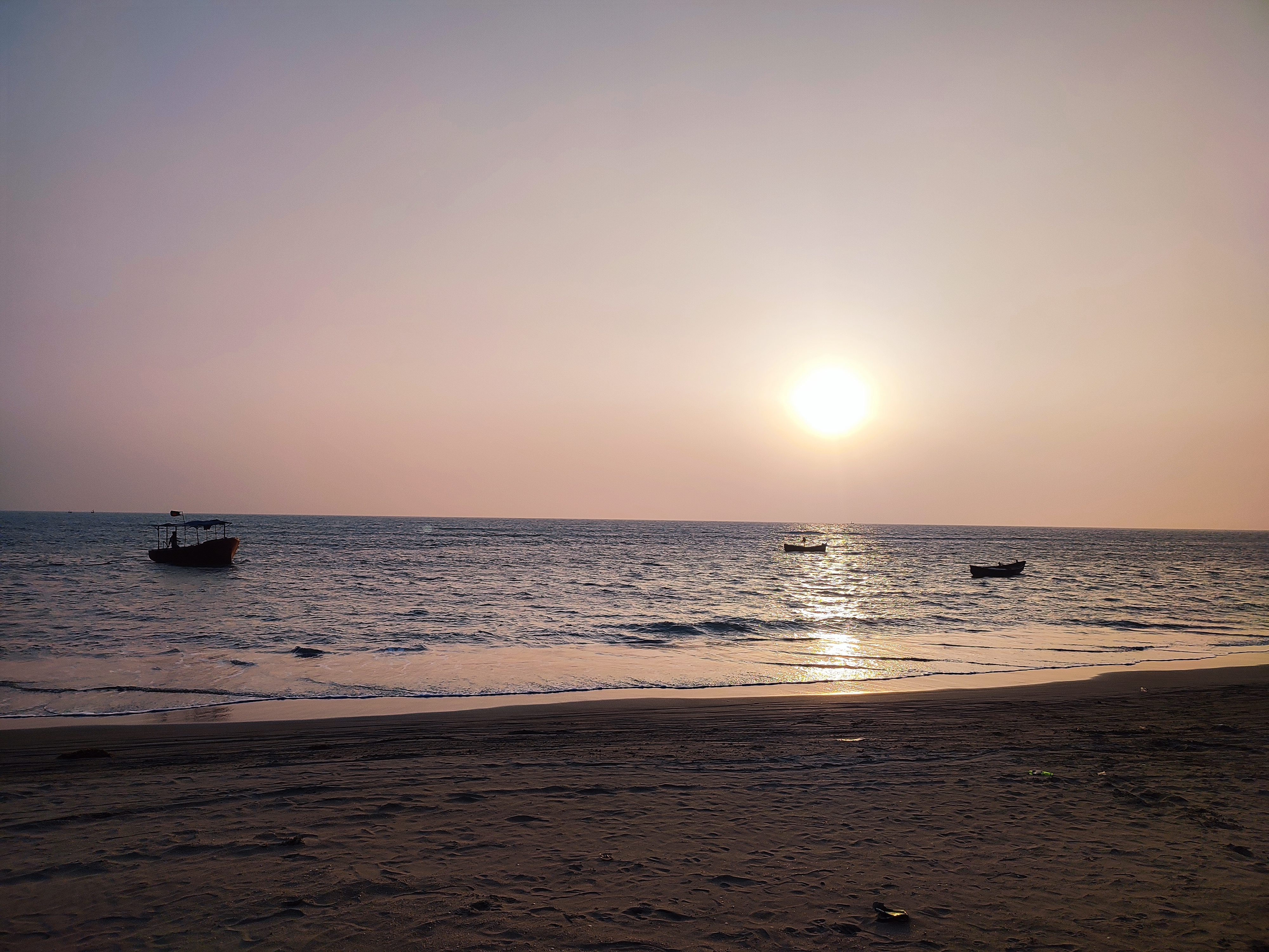 Sunset at Saint Martin’s Island with gentle waves lapping the shore.