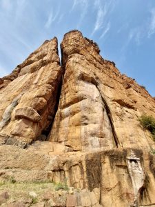 A dramatic split in the massive Badami cliffs forms a natural gateway, showcasing nature’s artistry alongside the region’s timeless charm.
