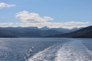 Seascape mountain vista from a boat on Loch Broom on a warm, hazy Summer's day.