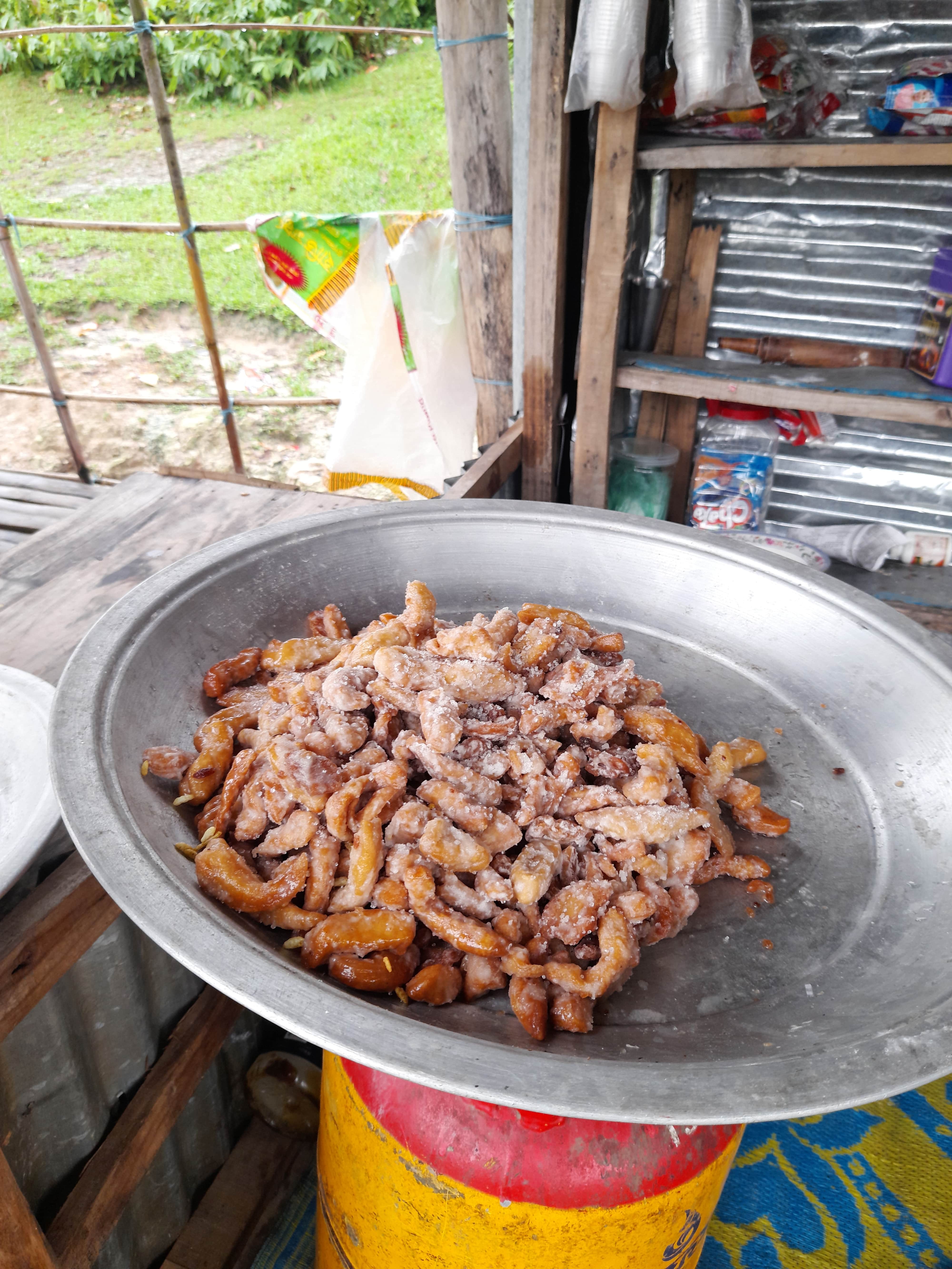 A metal pan displaying a serving of food, highlighting its texture and vibrant colors.