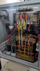 Internal parts of a UPS showing battery, capacitors without switch