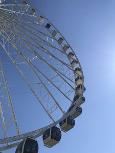 The Seattle Great Wheel against a clear, deep blue sky. 
