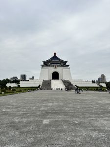 The Chiang Kai-shek Memorial Hall's front, featuring the white building with a blue roof and a wide plaza.