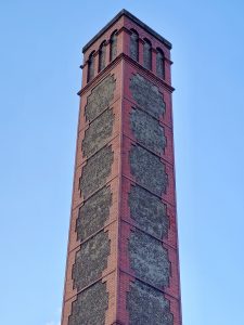 The upper portion of a historic brick and stucco tower, part of Portland's Union Station. 