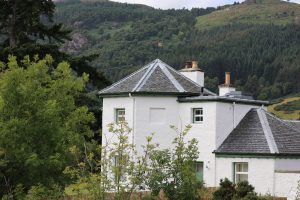 
Bona Lighthouse, more like a cottage with a hexagonal turret than a tall Scottish lighthouse, nestles among trees on the shore of Loch Ness.