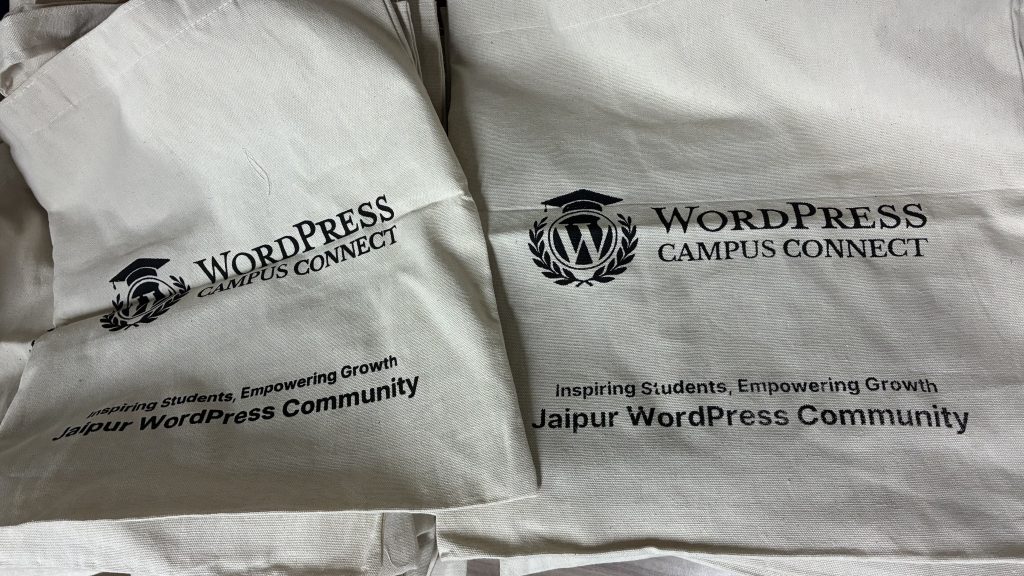 A close-up view of two tote bags, showcasing the WordPress Campus Connect Jaipur program