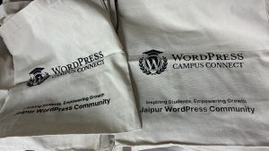 A close-up view of two tote bags, showcasing the WordPress Campus Connect Jaipur program
