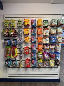 A neatly organized wall of candy bags
