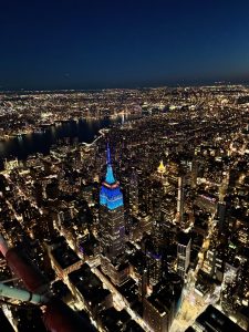 Empire State Building, Manhattan, New York. City skyline at night, with the empire state building lit up in bluw