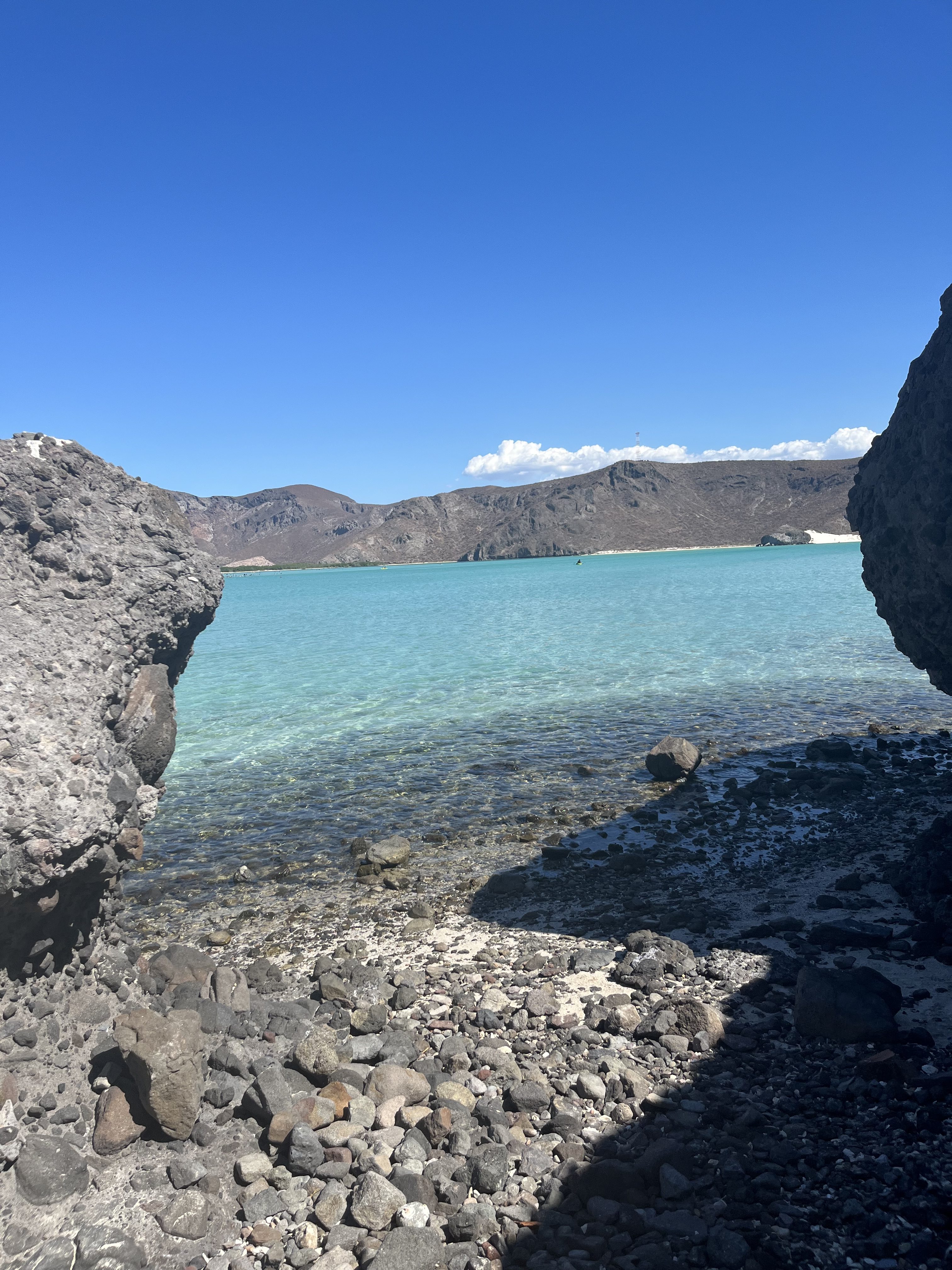 A peaceful coastal scene where the sea meets stone in perfect harmony.