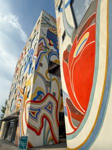 A brightly abstract colored/painted 6-story building in Portland, OR. 